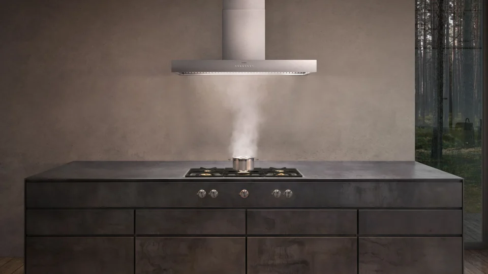 Wall-mounted, ceiling, table, and downdraft extraction for integrated kitchen layouts.